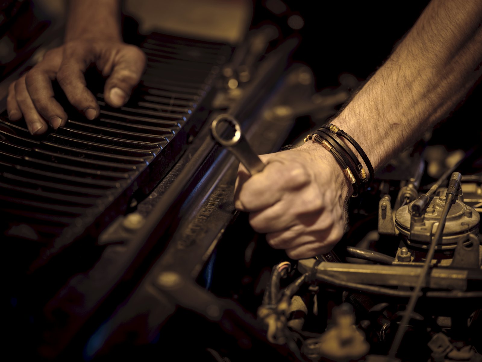 Technician working under the hood at GB Auto Repair & Service